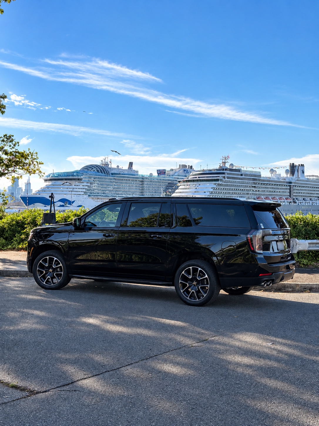 Black Chevrolet Suburban with cruise ships in the background