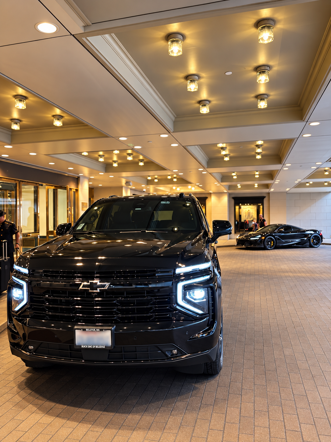 Black Chevrolet SUV at an executive hotel entrance