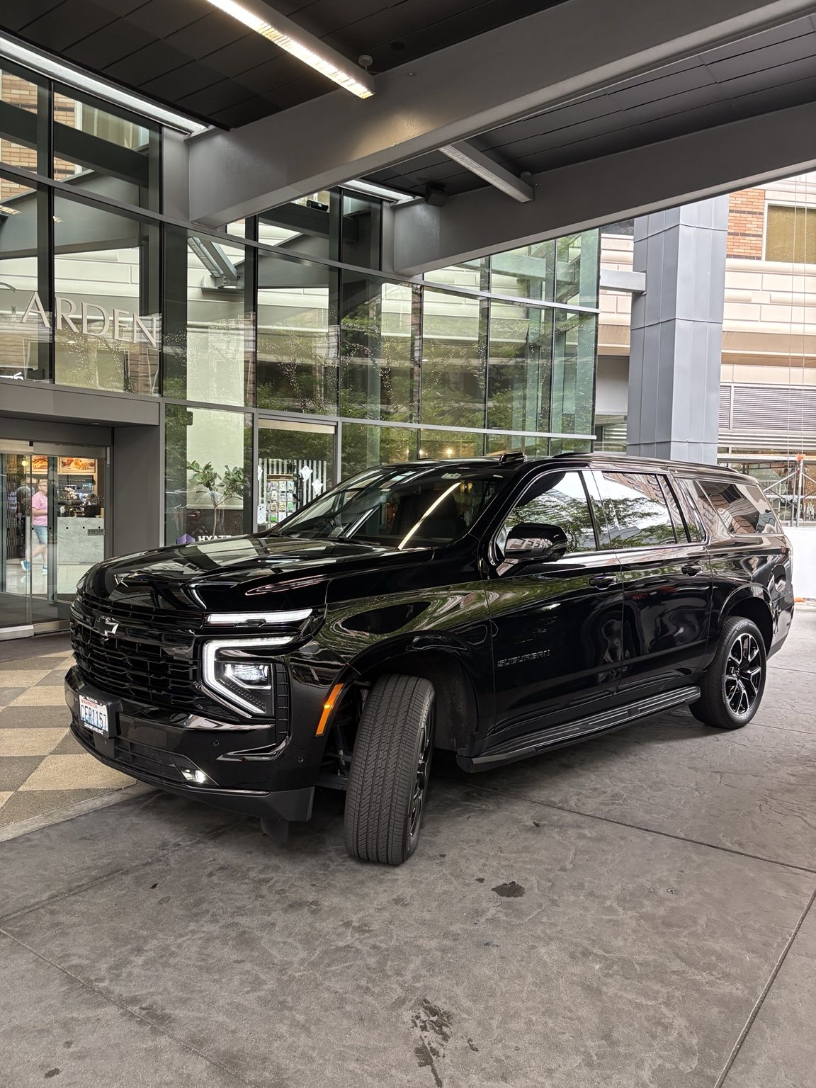 Black Chevrolet Suburban at a hotel
