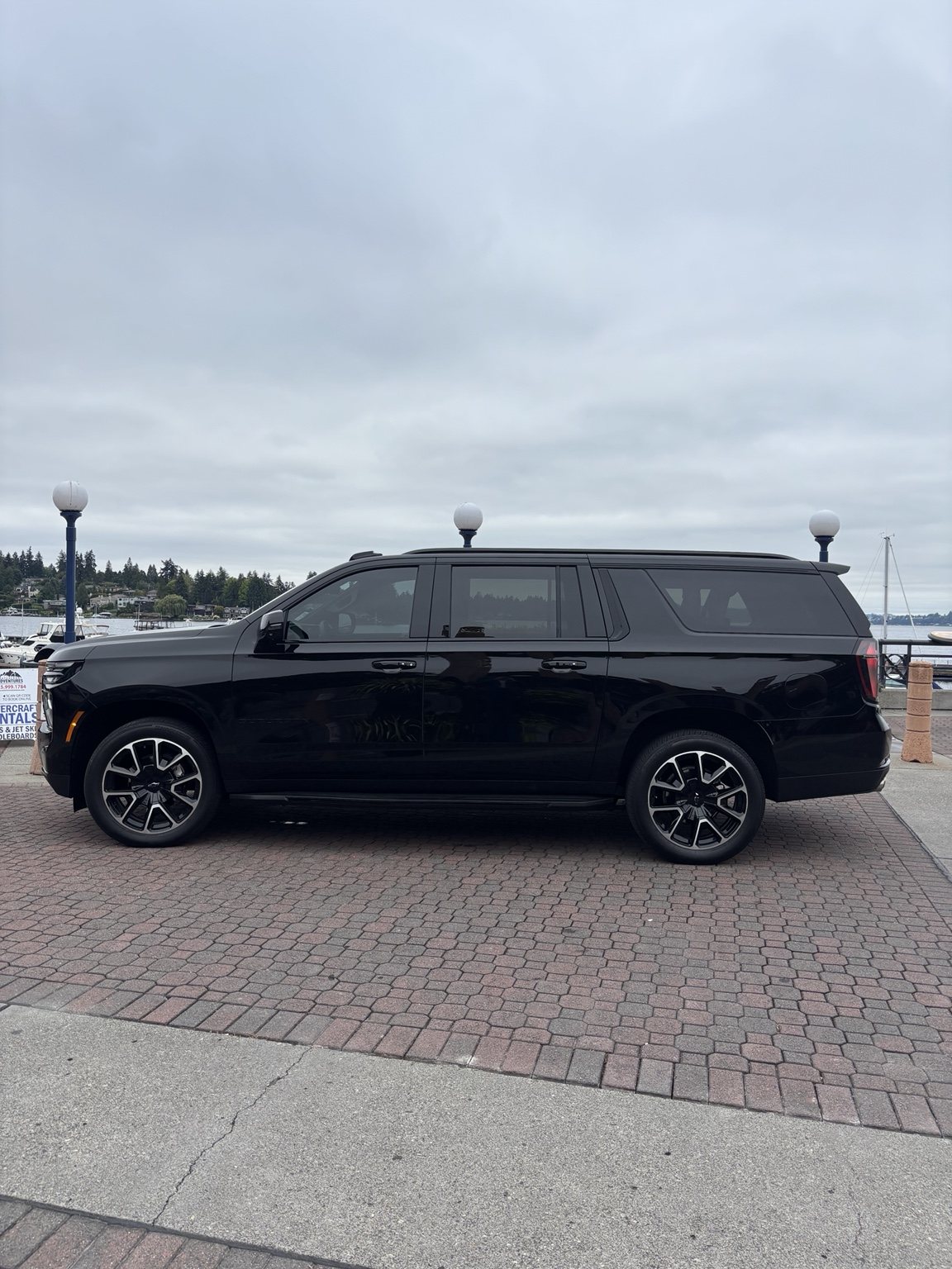 Black Chevrolet Suburban side profile